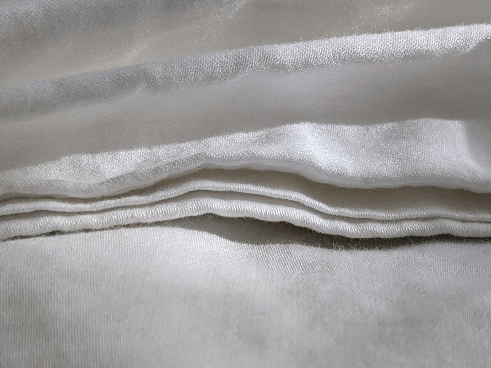 Close detail of folded white fabric